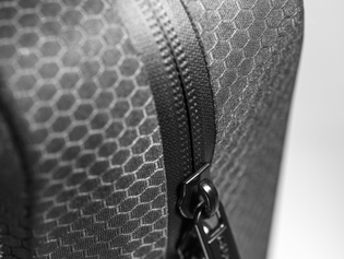 Water-repellent zippers and dedicated label slots